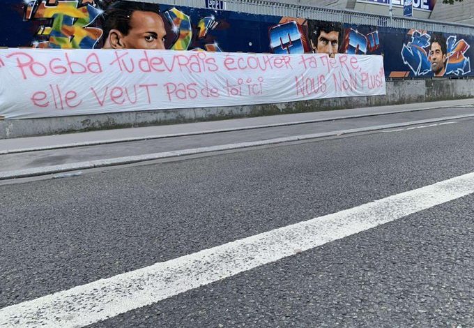 Photo: PSG fans hang anti-Pogba banner outside Parc des Princes